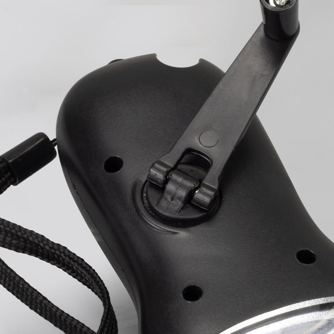 A black Dynamo Solar Torch featuring a foldable handle and a lanyard attachment.