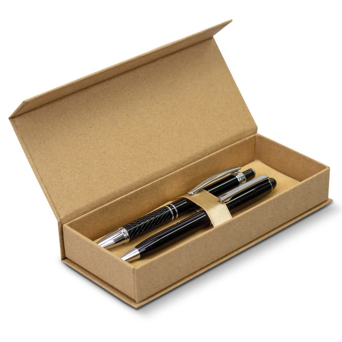 A kraft gift box containing two black pens with silver accents, featuring a simple logo on the lid.