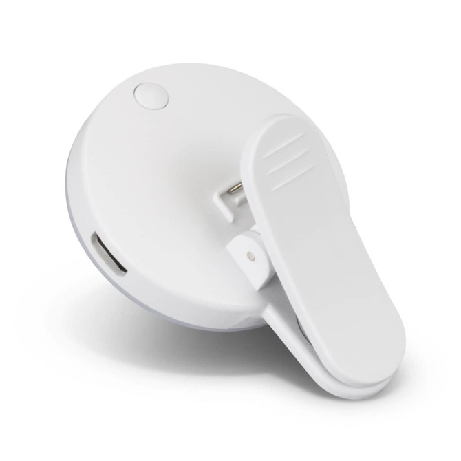 A white Halo Selfie Light with a clip design and a small button, featuring a logo on the surface.