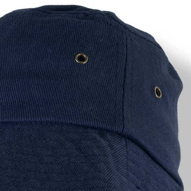 A navy Yuma Bucket Hat featuring a textured fabric and ventilation eyelets. The hat has a logo on it.