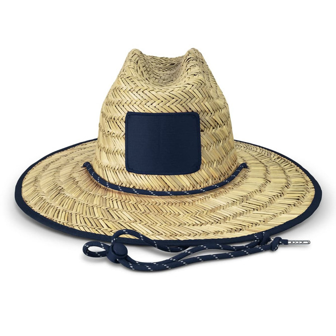 A straw hat in a natural beige colour with a navy blue band and adjustable chin strap. It features a branding patch.