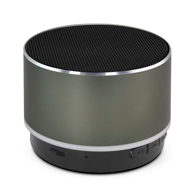 A round Bluetooth speaker in matte grey with a black speaker grill and a silver trim, featuring a branding logo.