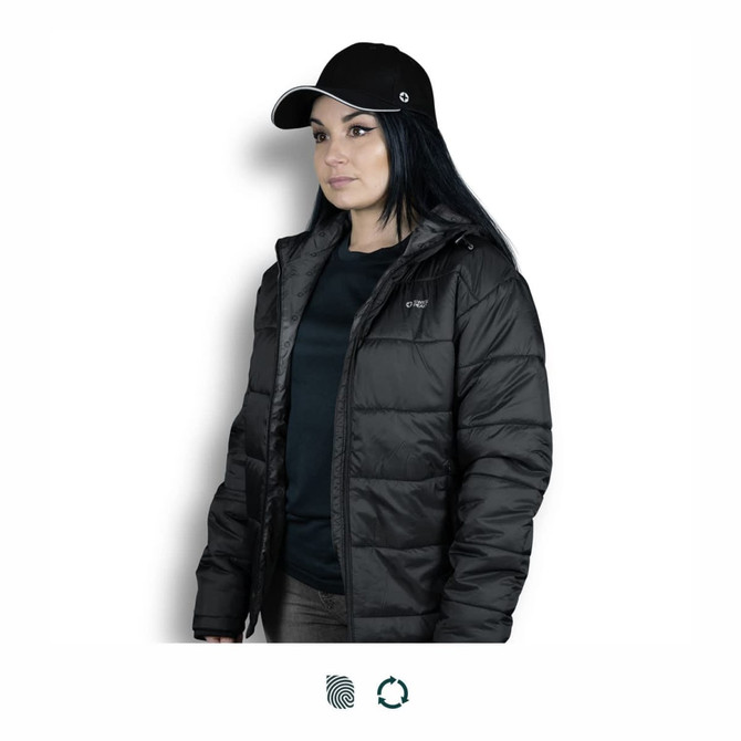 A black Swiss Peak Urban Puffer Jacket worn by a woman, paired with a black cap. The jacket features a logo.