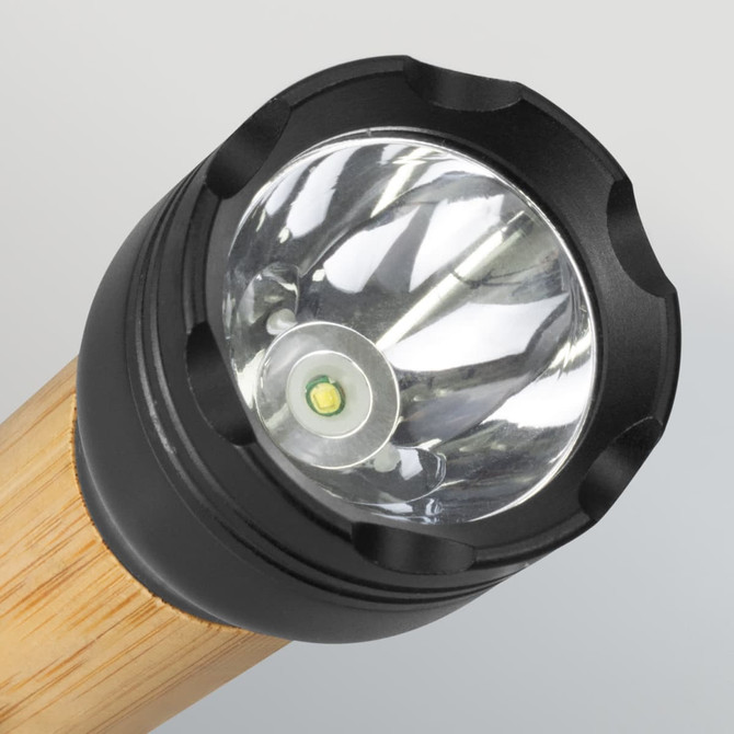 A bamboo torch with a black head and a clear lens, featuring a single LED light in the centre.