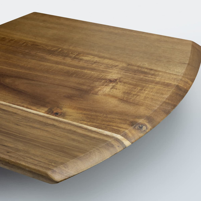 A wooden cheese board with a smooth surface and rounded edges in a natural brown tone, featuring a rustic finish.