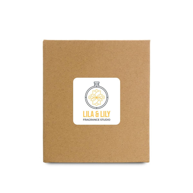 A large candle packaged in a simple brown box featuring a label with the logo of Lila & Lily Fragrance Studio.