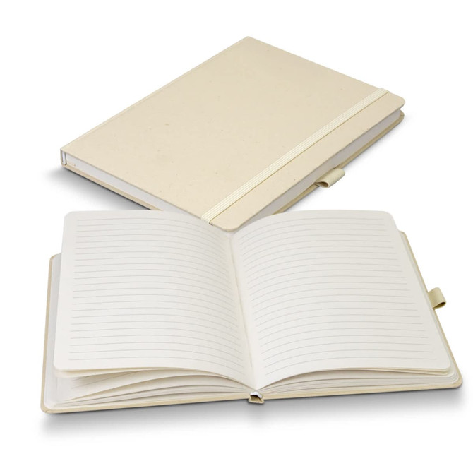 A cream-coloured hardcover notebook with lined pages, featuring a logo on the cover.