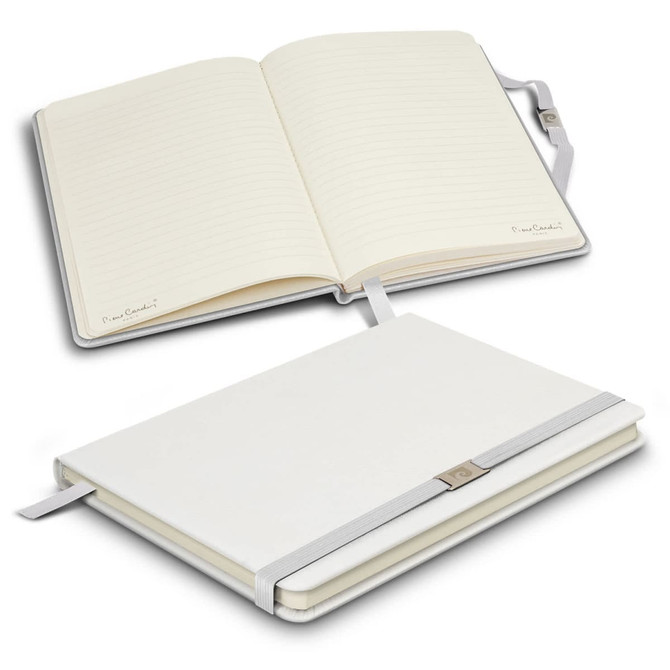 A white notebook with lined pages, featuring a ribbon bookmark and a clasp. It includes a logo on the cover.