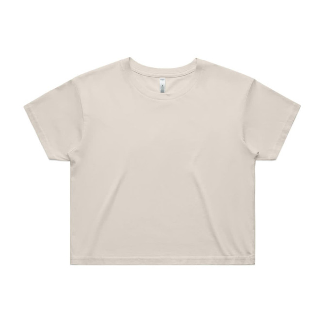 A light beige crop tee with a relaxed fit, featuring a simple design and a logo on the label.