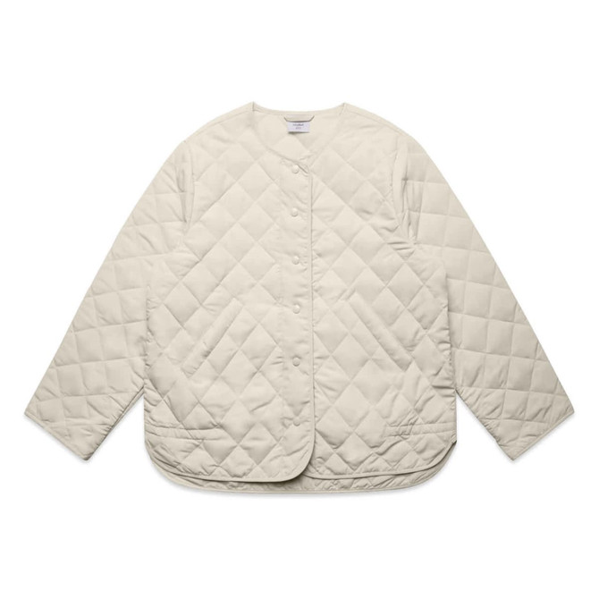 A cream-coloured quilted jacket with a rounded hem and snap buttons, featuring a logo on the label.