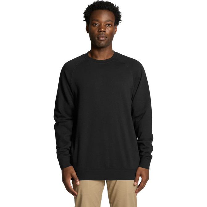 A black sweater is featured, worn by a model standing against a plain background. It has a logo on the chest.