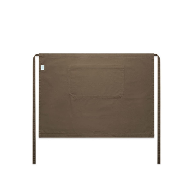 A brown canvas half apron featuring a large front pocket and ties on either side. It has a logo displayed.