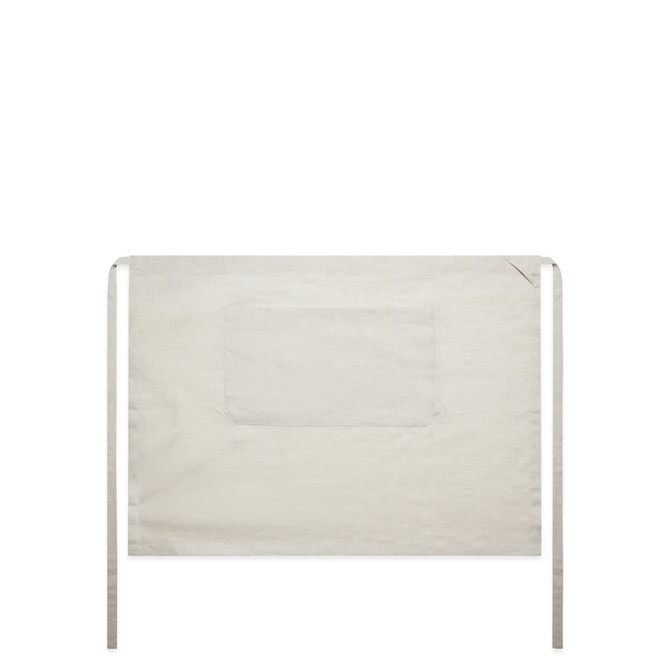 A plain linen half apron in a light beige colour with a front pocket and ties. Features a logo.