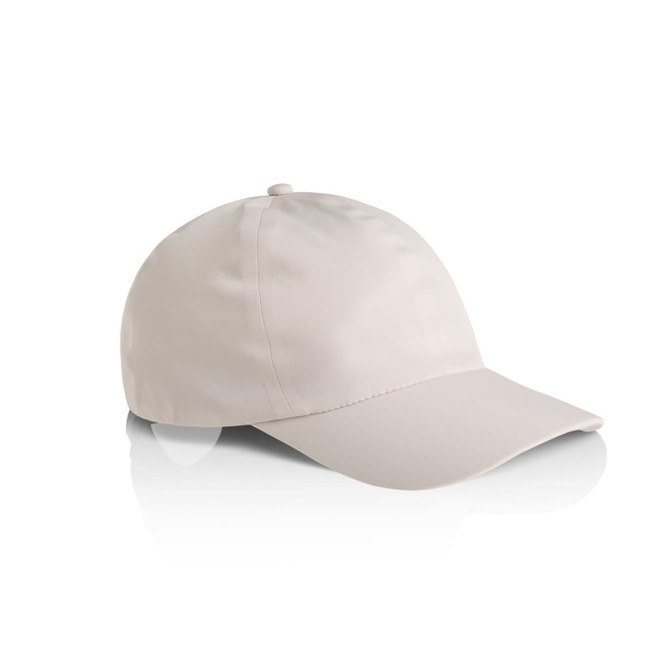 A beige cap with a rounded crown and a curved brim, featuring a logo on the front.
