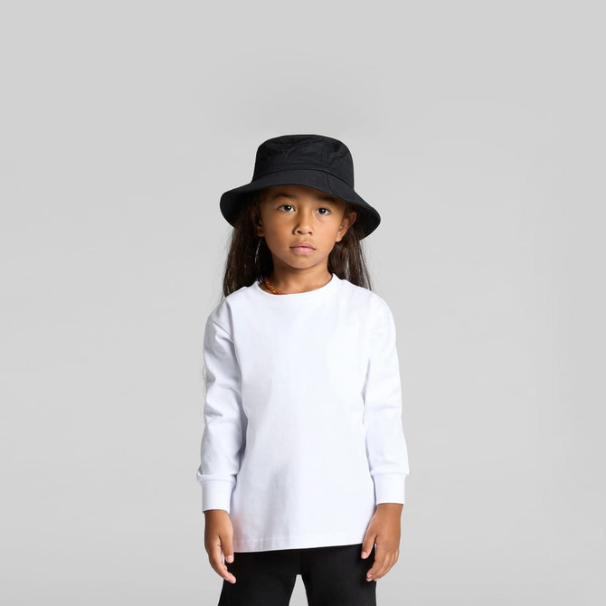 A long-sleeved white T-shirt for kids, paired with a black bucket hat. The shirt has a simple design and logo.