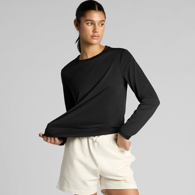 A long-sleeve black tee is displayed, featuring a simple design and a logo, paired with light-coloured shorts.