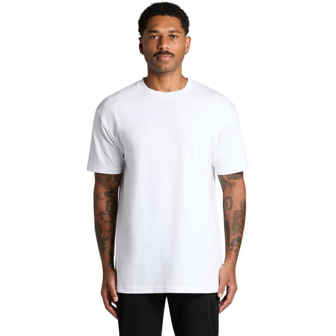 A white Block Tubular Tee displayed on a male model with tattoos, featuring a simple design and a logo.