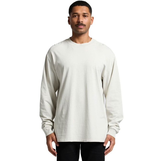 A long-sleeve tee in a faded cream colour, featuring a relaxed fit and a logo on the front.