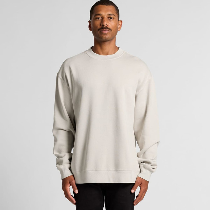 A beige crew jumper featuring long sleeves and a relaxed fit, displayed on a model against a neutral backdrop.