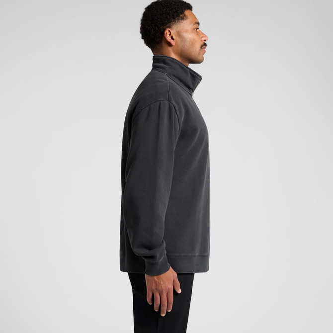 A relaxed grey half zip jacket displayed on a model from the side, featuring a logo on the chest.