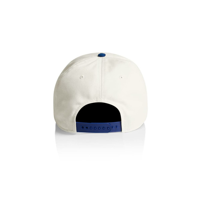 A two-tone cap featuring a cream exterior and a navy blue underside. It includes an adjustable strap and has a logo.