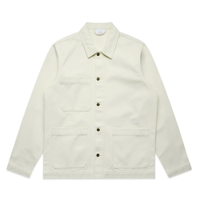 A light cream canvas chore jacket with button closures and multiple pockets, featuring a brand logo.