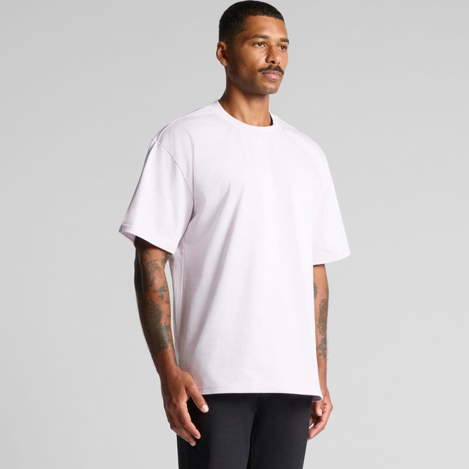 A light purple heavy t-shirt displayed on a model, featuring a simple design and casual fit.