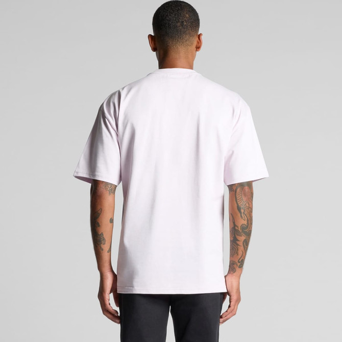 A back view of a plain heavy tee in pale pink, featuring short sleeves and a logo.