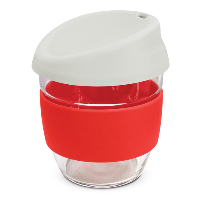A drink bottle featuring a clear borosilicate body with a red silicone sleeve and a white lid. It has a logo.