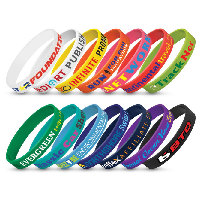 A collection of silicone wristbands in various colours, each featuring different branding and slogans.