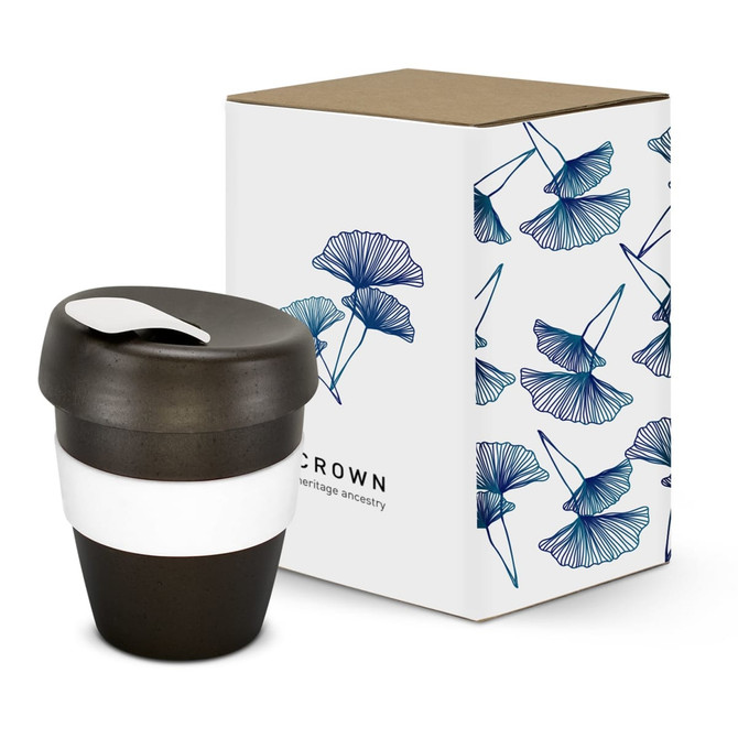 A drink bottle in black with a white band, next to a floral-patterned box. The bottle has a lid and a logo.