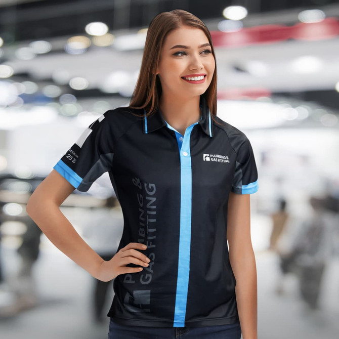 A black women's performance polo shirt with blue accents and a logo on the sleeve.