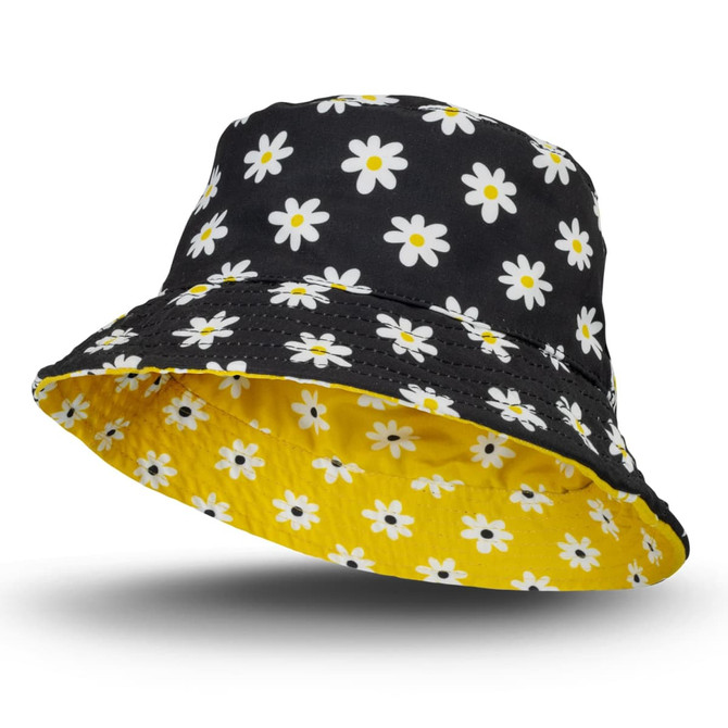 A reversible bucket hat featuring a black floral pattern with daisies and a yellow inner lining. Includes a logo.