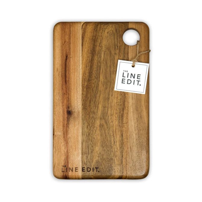 Acacia serving board with a natural wood finish and a round cut-out, featuring a tag and a logo.