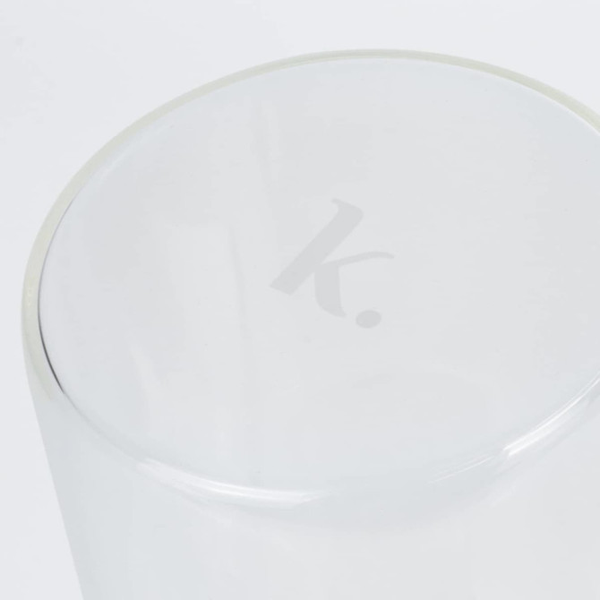 A transparent glass canister with a smooth rim and a subtle logo on the top.