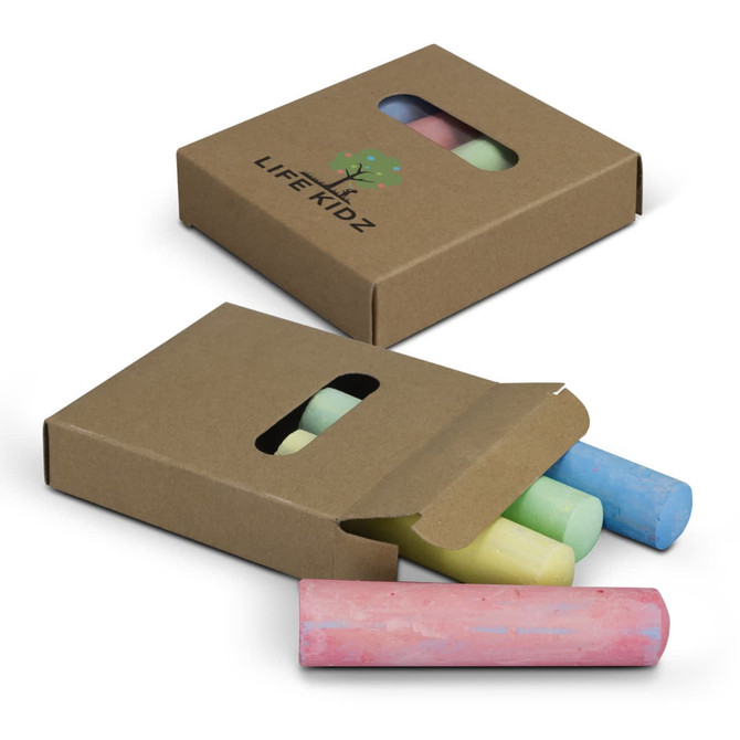 A cardboard box contains several pieces of jumbo sidewalk chalk in pastel colours, including pink, blue, green, and yellow.