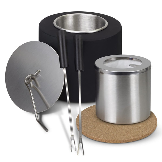 A black and silver Keepsake S'mores Kit featuring a container, roasting forks, and a protective cork base.