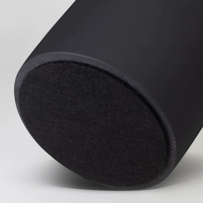 A black cylindrical product with a flat, textured base and a smooth finish on the body, featuring a logo.