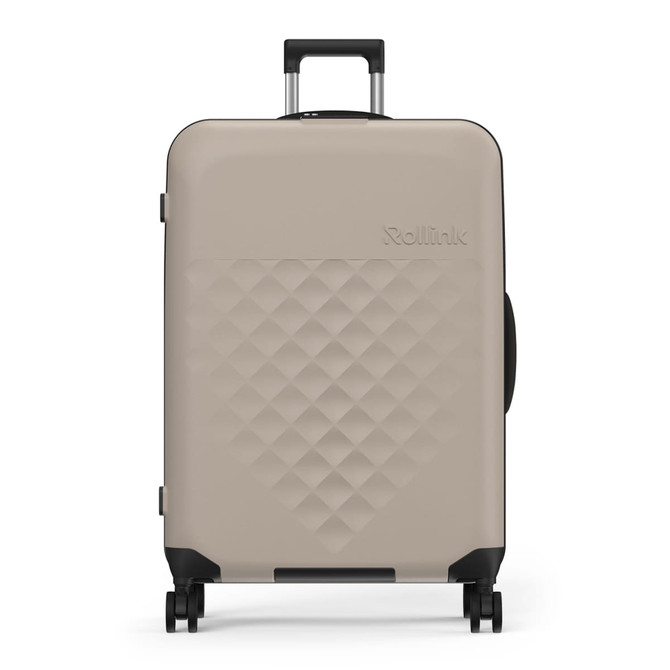 A taupe 29" Rollink Flex 360 Spinner Suitcase with a patterned surface and a retractable handle.
