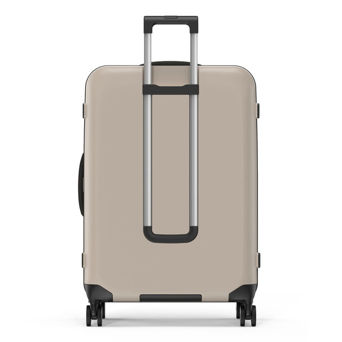 A beige wheeled suitcase with a retractable handle and spinner wheels. It features a logo on the front.