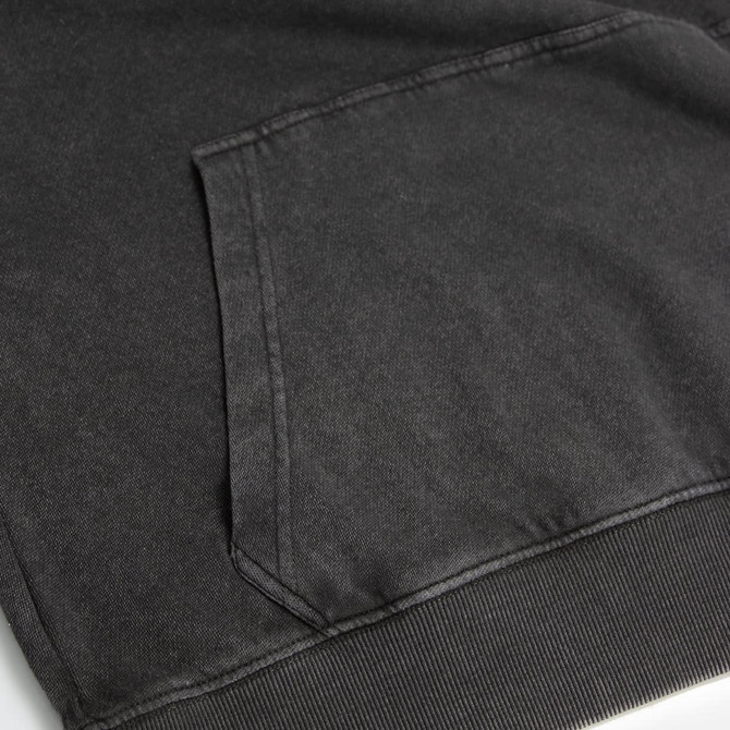 A faded black unisex hoodie featuring a front pocket and ribbed cuffs. It has a subtle logo on the fabric.