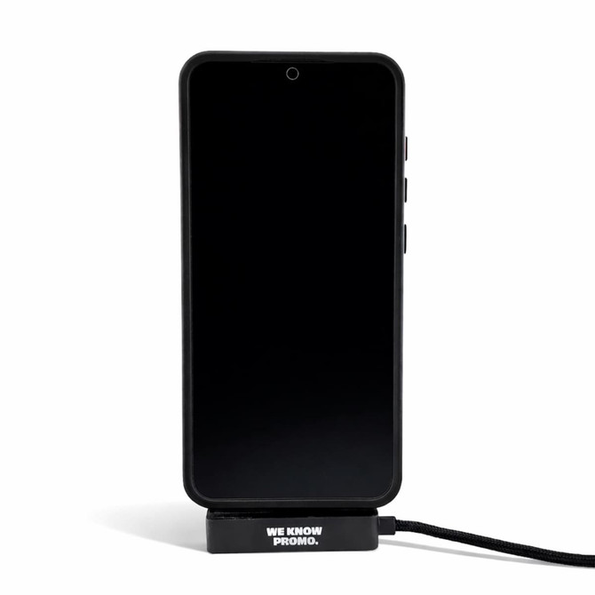 A black promotional phone stand featuring a charging cable, designed for mobile devices.