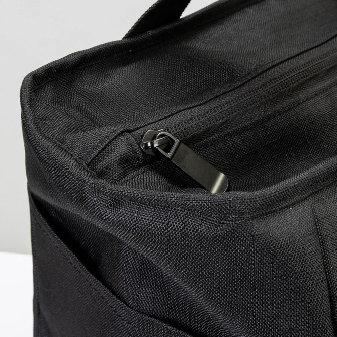 A black cooler bag with a zip closure and textured fabric, featuring an exterior pocket.