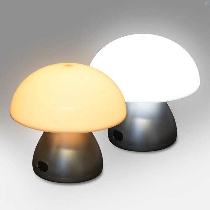 A Portobello table lamp with a mushroom shape, featuring a white shade and an orange shade, set against a grey background.