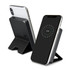 A black wireless charging power bank with a stand, featuring a smartphone displaying a charging indicator.