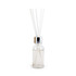 A glass bottle with a silver lid, containing clear liquid and four white reeds for fragrance diffusion.