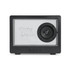 A black speaker with a prominent circular speaker and a transparent front, featuring branding and control buttons at the bottom.