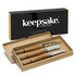 A set of three cheese knives with wooden handles in a gift box, featuring a black branding logo.