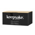 A coffee mug set packaging featuring a black box with a logo, designed for Keepsake Moda.