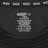 A black unisex t-shirt made from 100% polyester, featuring care instructions and a brand logo inside the collar.
